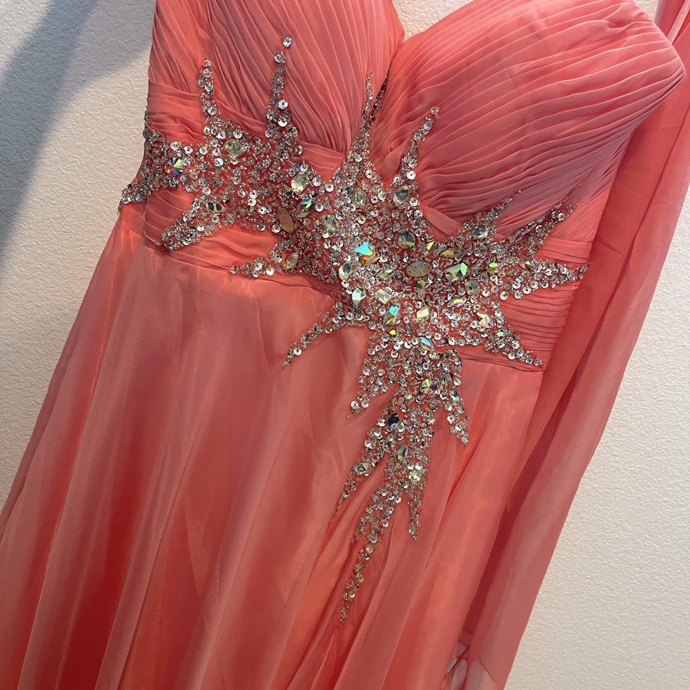 Dollar. Medium. Coral color, not pink